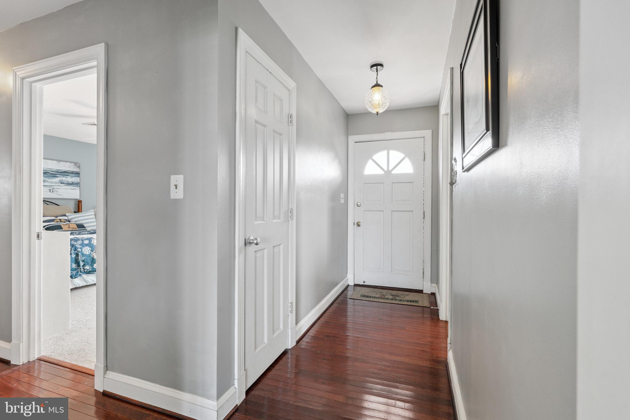 2554 Hoopers Island Road Fishing Creek, MD 21634 - Photo 33 of 85 a view of a hallway with wooden floor
