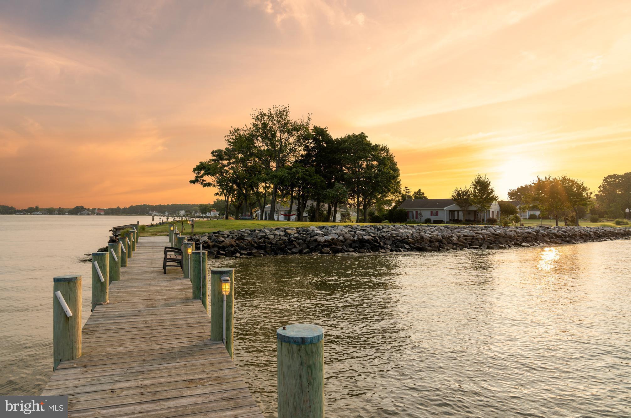 2554 Hoopers Island Road Fishing Creek, MD 21634 - Photo 4 of 85 a view of a lake with boats and trees in the background