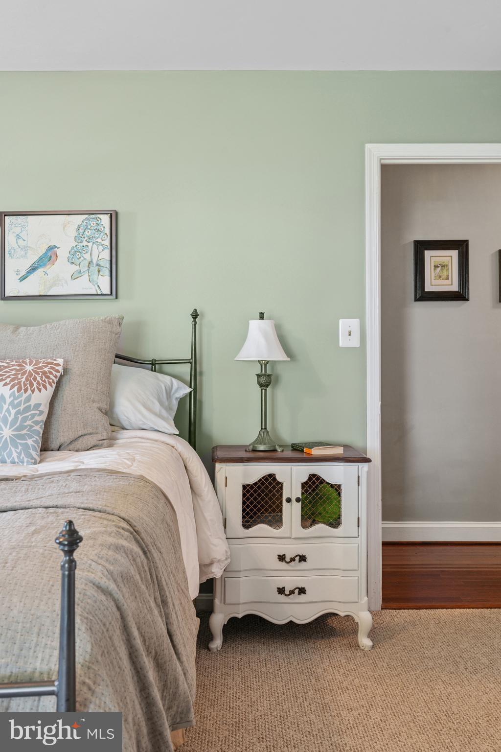 2554 Hoopers Island Road Fishing Creek, MD 21634 - Photo 42 of 85 a bedroom with a bed and a chandelier