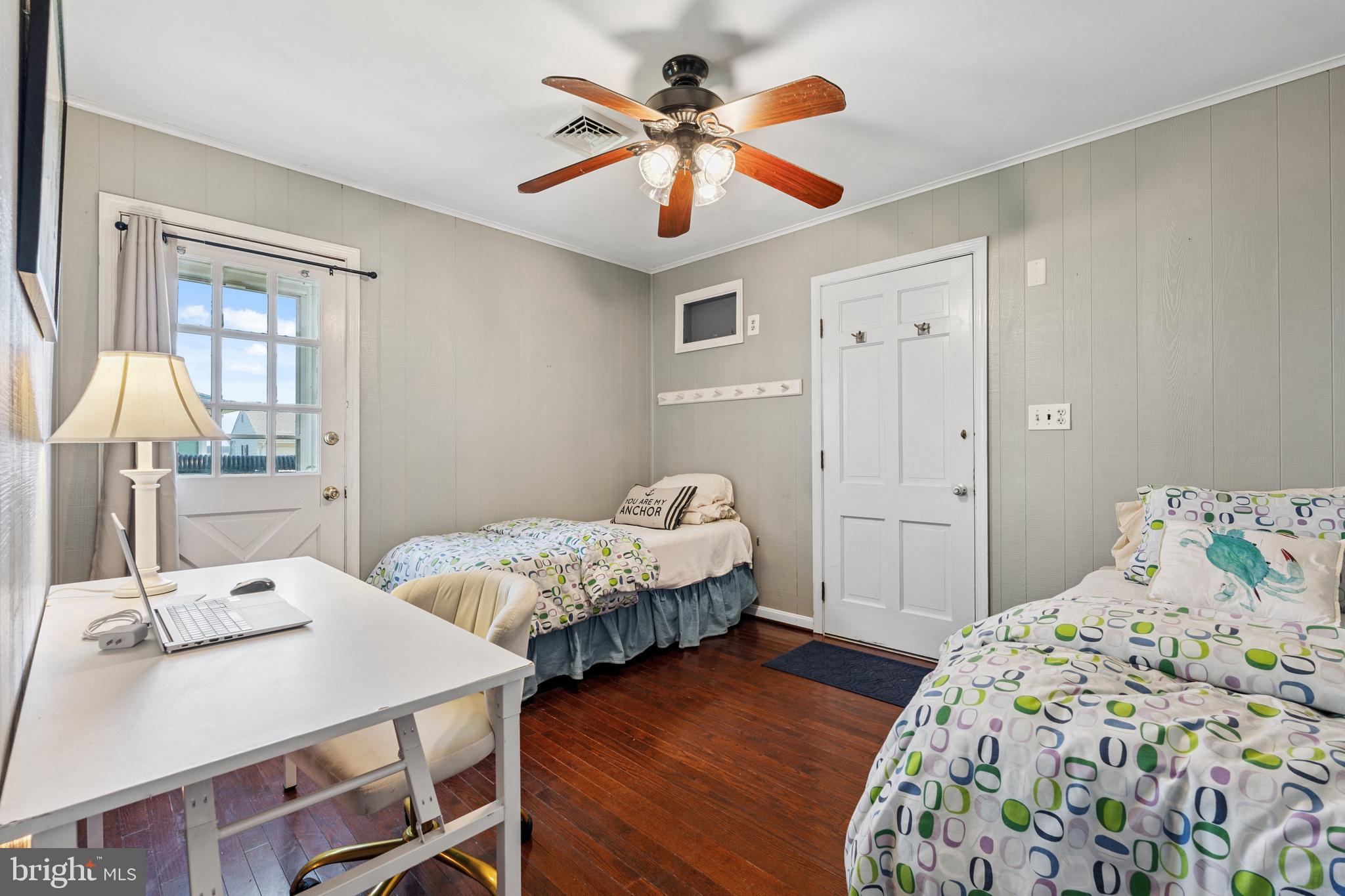 2554 Hoopers Island Road Fishing Creek, MD 21634 - Photo 49 of 85 a bedroom with a bed and a table in it