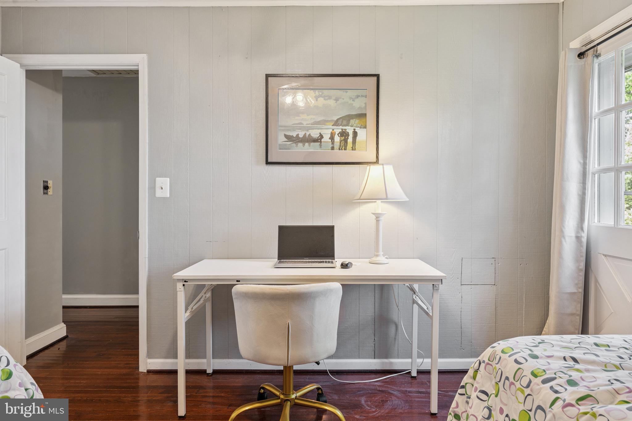 2554 Hoopers Island Road Fishing Creek, MD 21634 - Photo 50 of 85 a view of a bedroom with bed and wooden floor