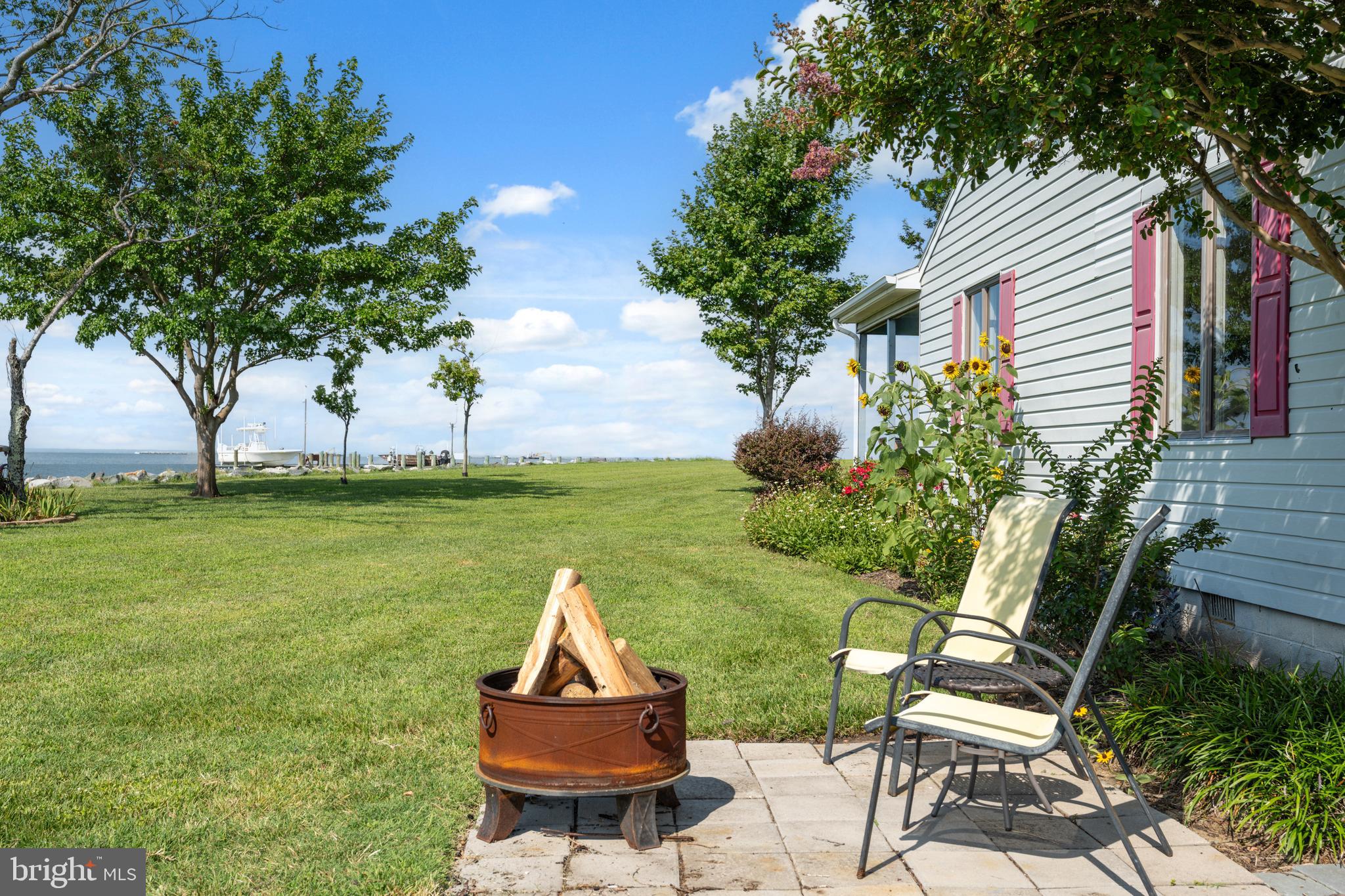 2554 Hoopers Island Road Fishing Creek, MD 21634 - Photo 67 of 85 a view of a house with backyard and sitting area