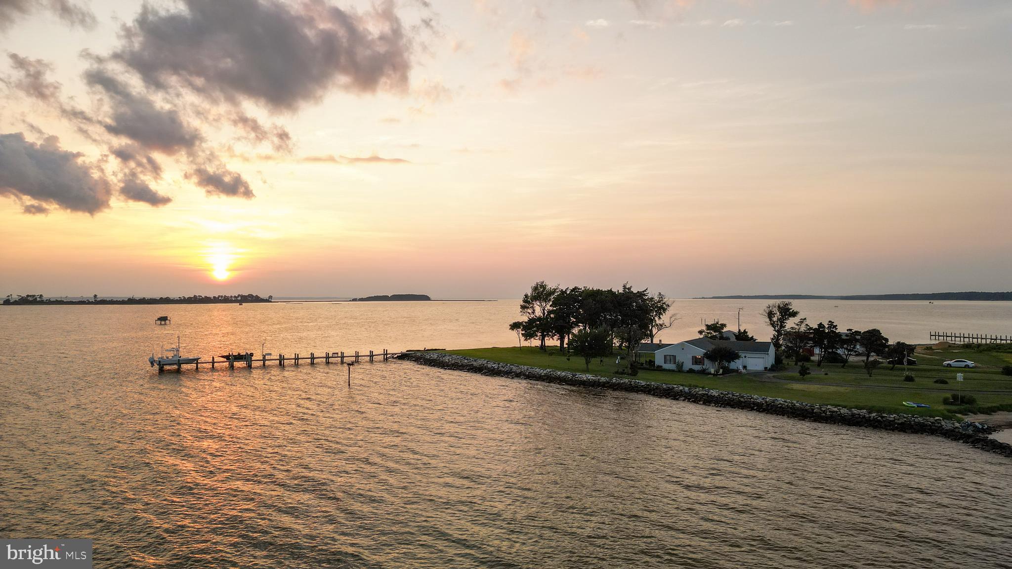 2554 Hoopers Island Road Fishing Creek, MD 21634 - Photo 75 of 85 a view of a lake with boats and trees in the back