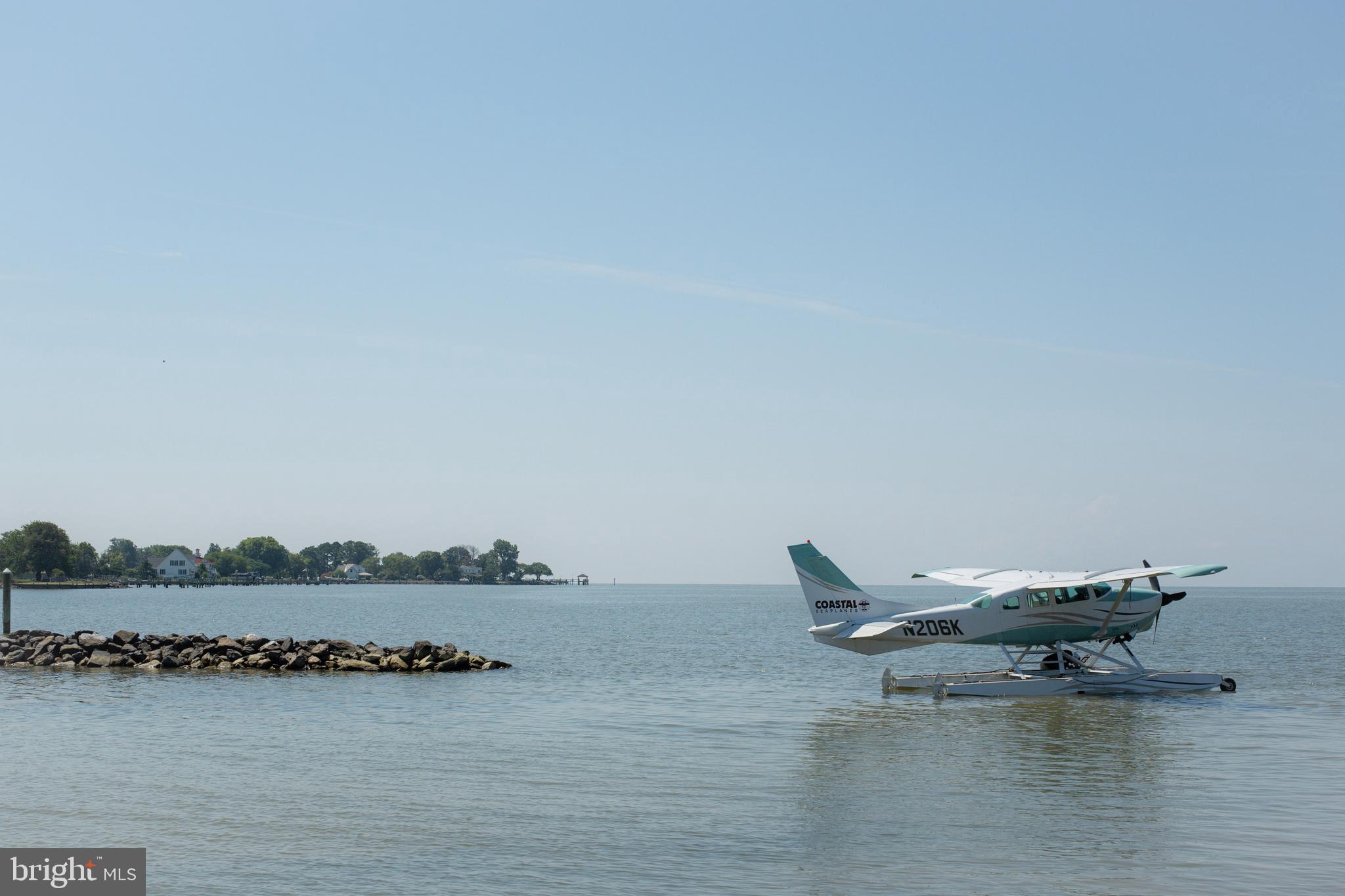 2554 Hoopers Island Road Fishing Creek, MD 21634 - Photo 84 of 85 a view of an ocean with boats and trees in the background