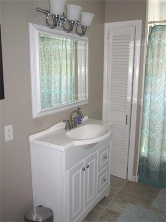 142 Haggetts Pond Road Andover, MA 01810 - Photo 13 of 21 a bathroom with a sink a vanity and a mirror
