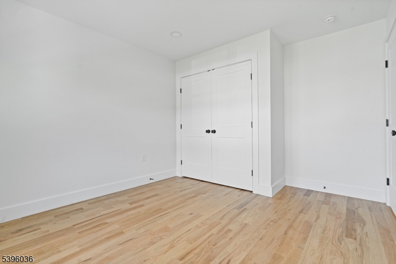 401 Tillman Street, Unit B Raritan, NJ 08869 - Photo 16 of 28 a view of empty room with wooden floor