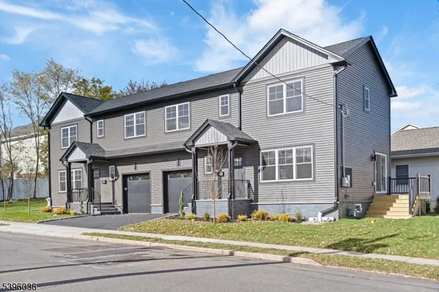 a view of a house with a swimming pool and a yard