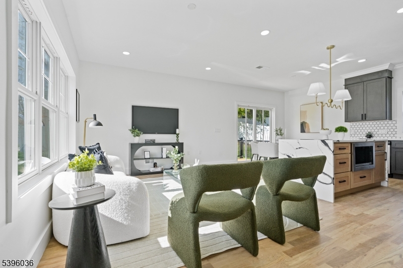 401 Tillman Street, Unit B Raritan, NJ 08869 - Photo 3 of 28 a living room with furniture a flat screen tv and a fireplace