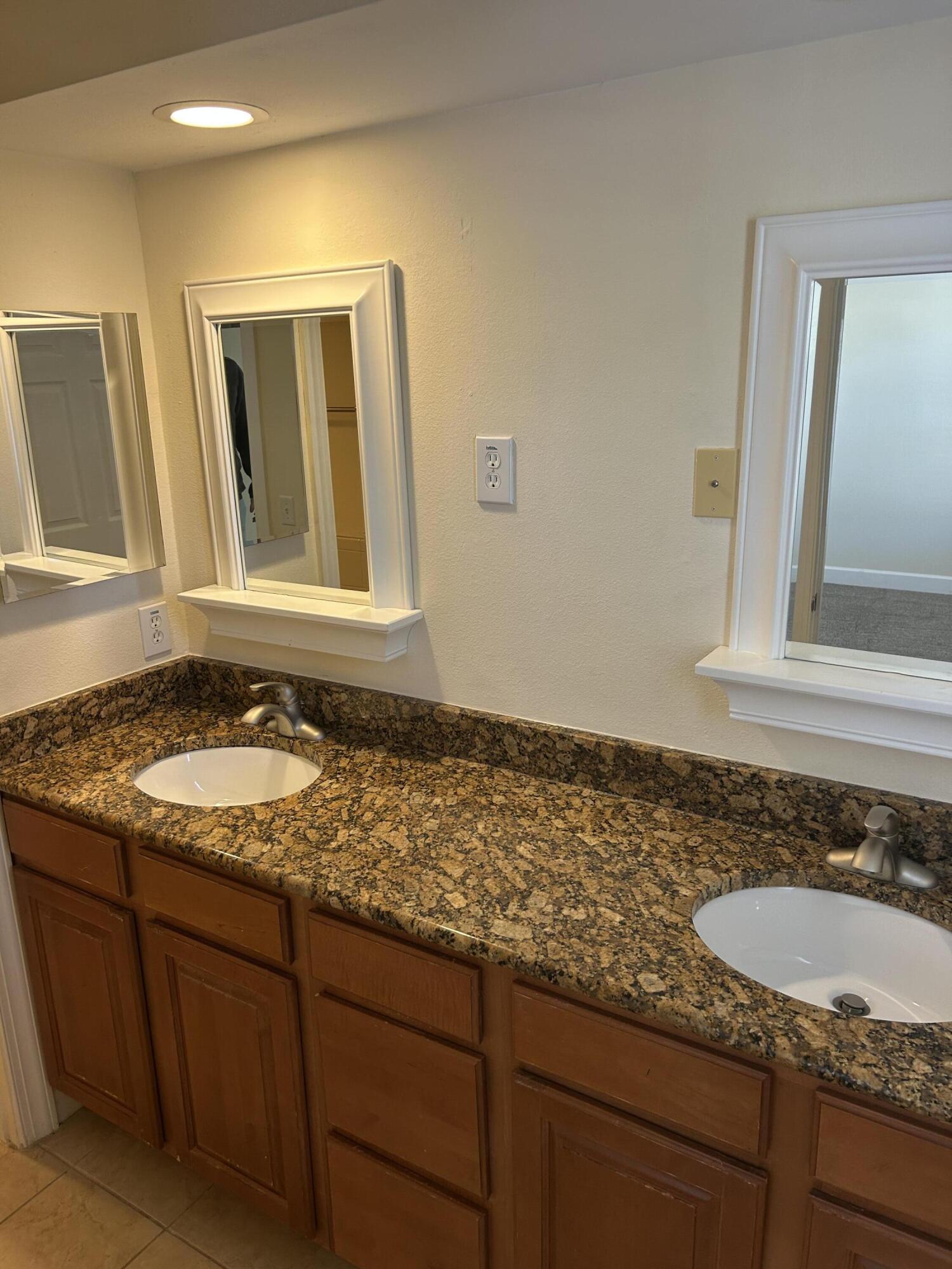 17 Bald Eagle Court, Unit 6G Santa Rosa Beach, FL 32459 - Photo 9 of 12 a bathroom with a granite countertop sink and a mirror