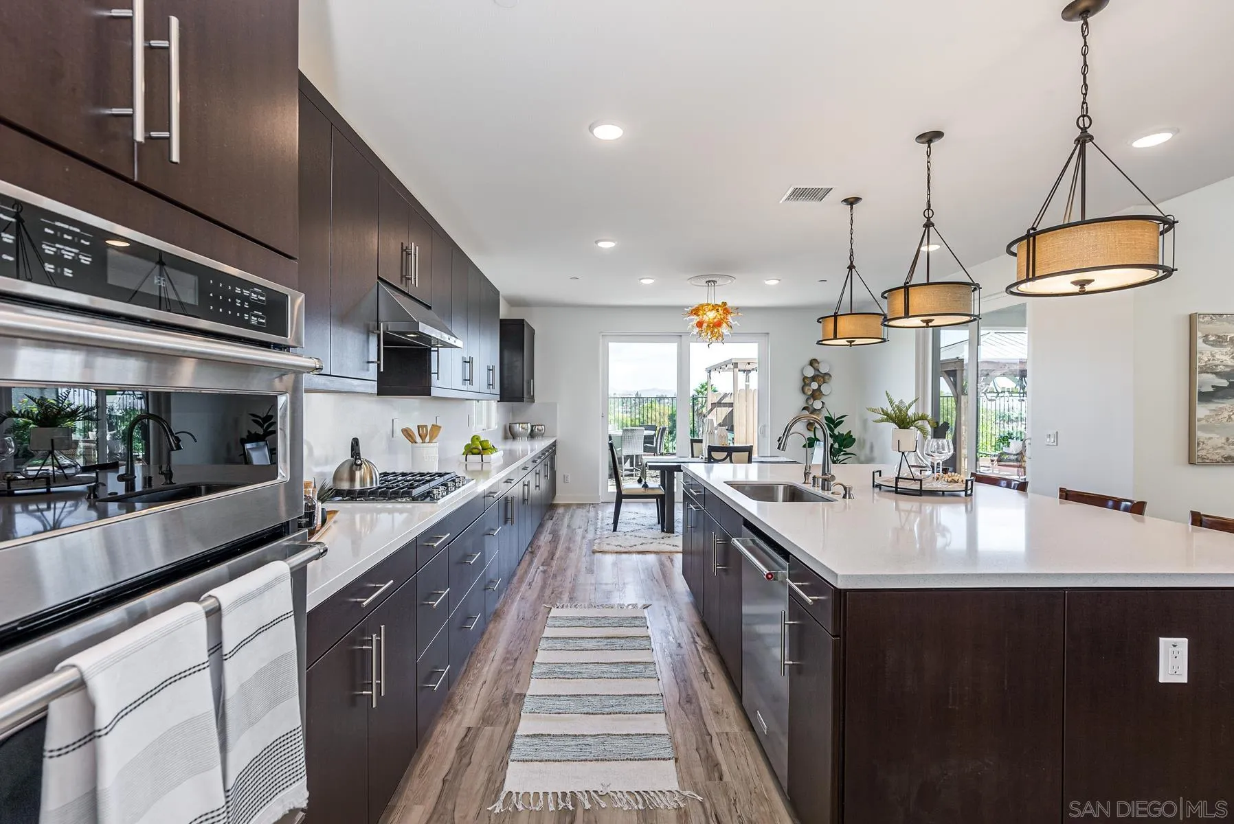 8855 Weston Road Santee, CA 92071 - Photo 17 of 36 a kitchen with kitchen island granite countertop lots of counter top space