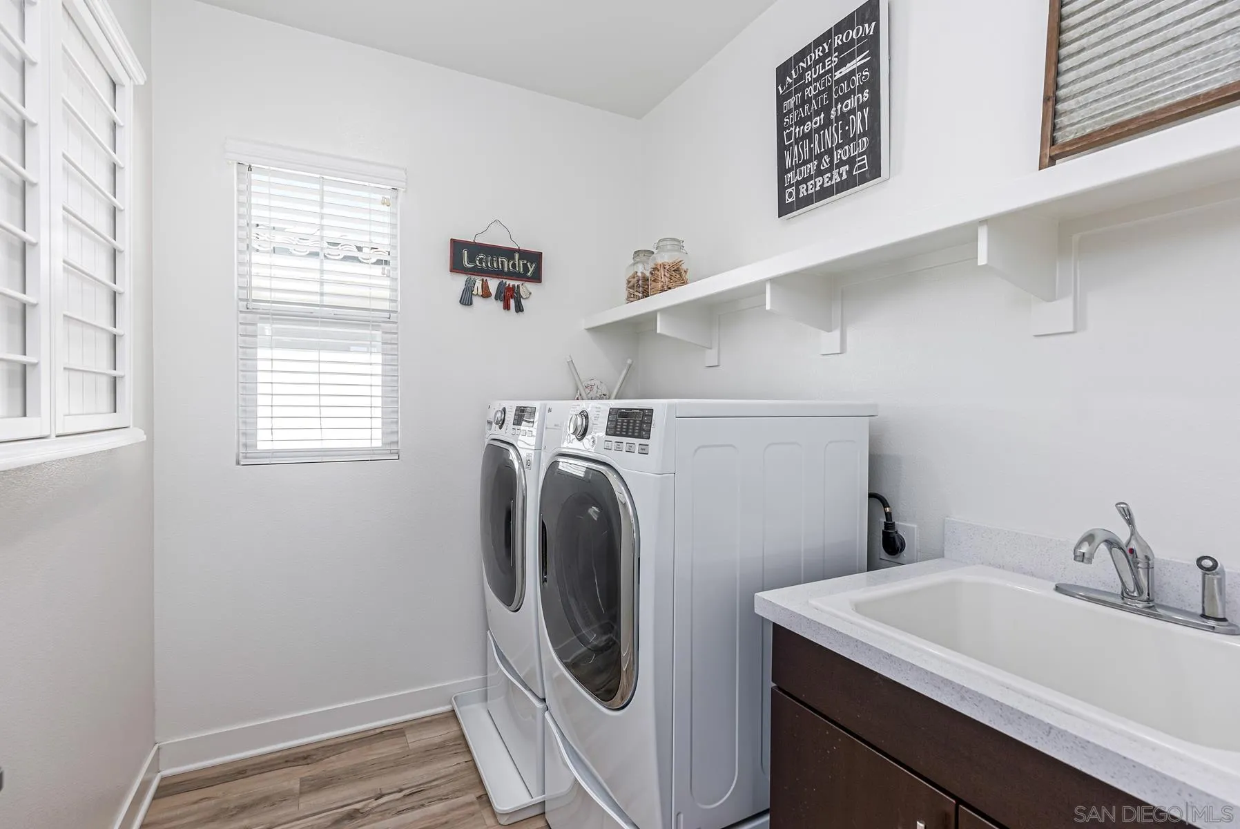 8855 Weston Road Santee, CA 92071 - Photo 25 of 36 a utility room with dryer and washer