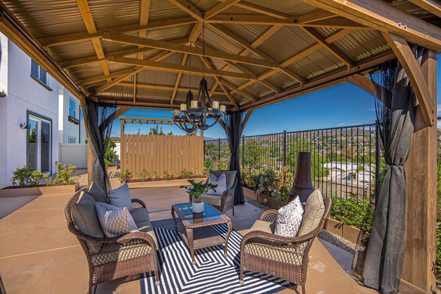 8855 Weston Road Santee, CA 92071 - Photo 28 of 36 a outdoor living space with furniture and umbrella