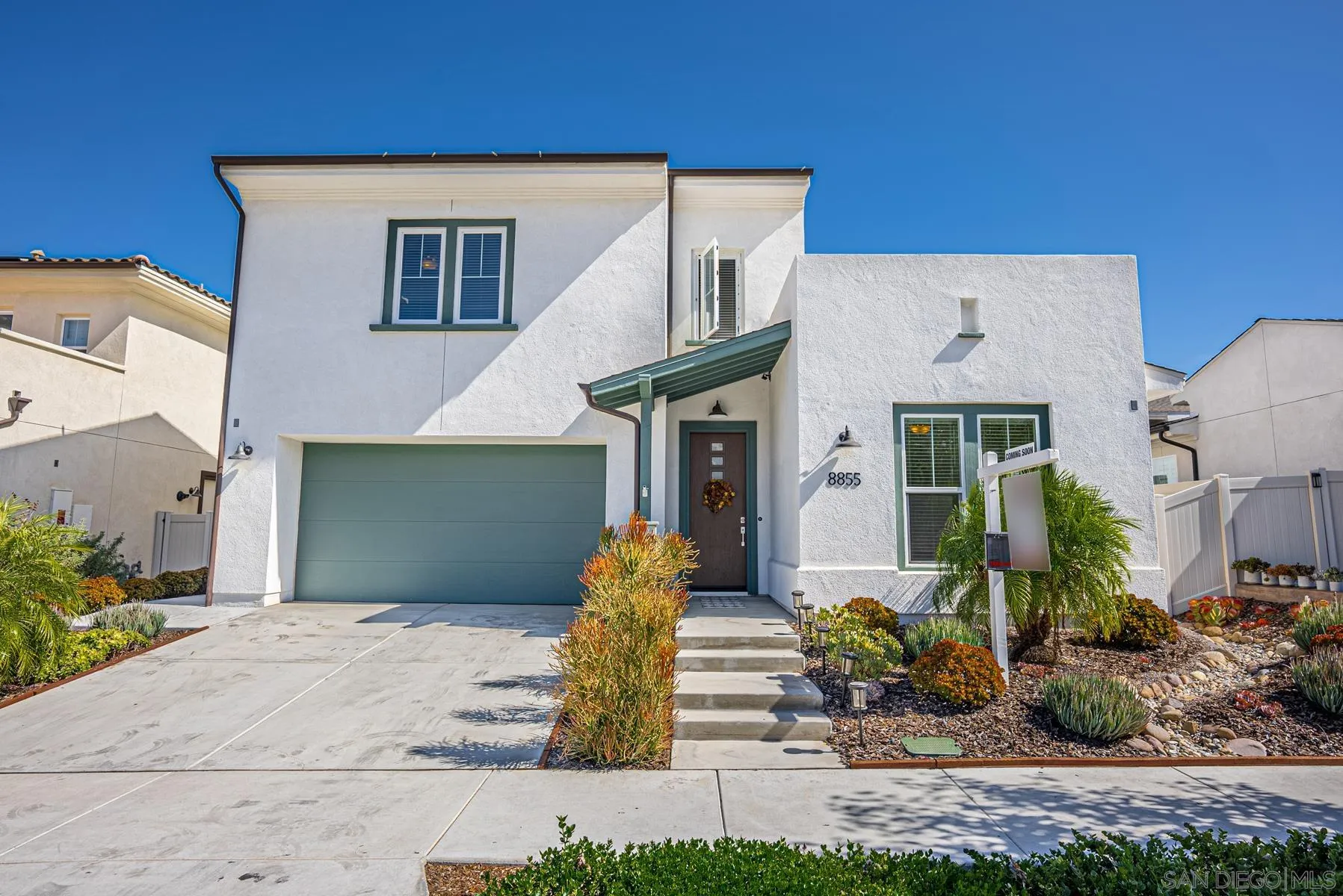 8855 Weston Road Santee, CA 92071 - Photo 3 of 36 a front view of a house with garden
