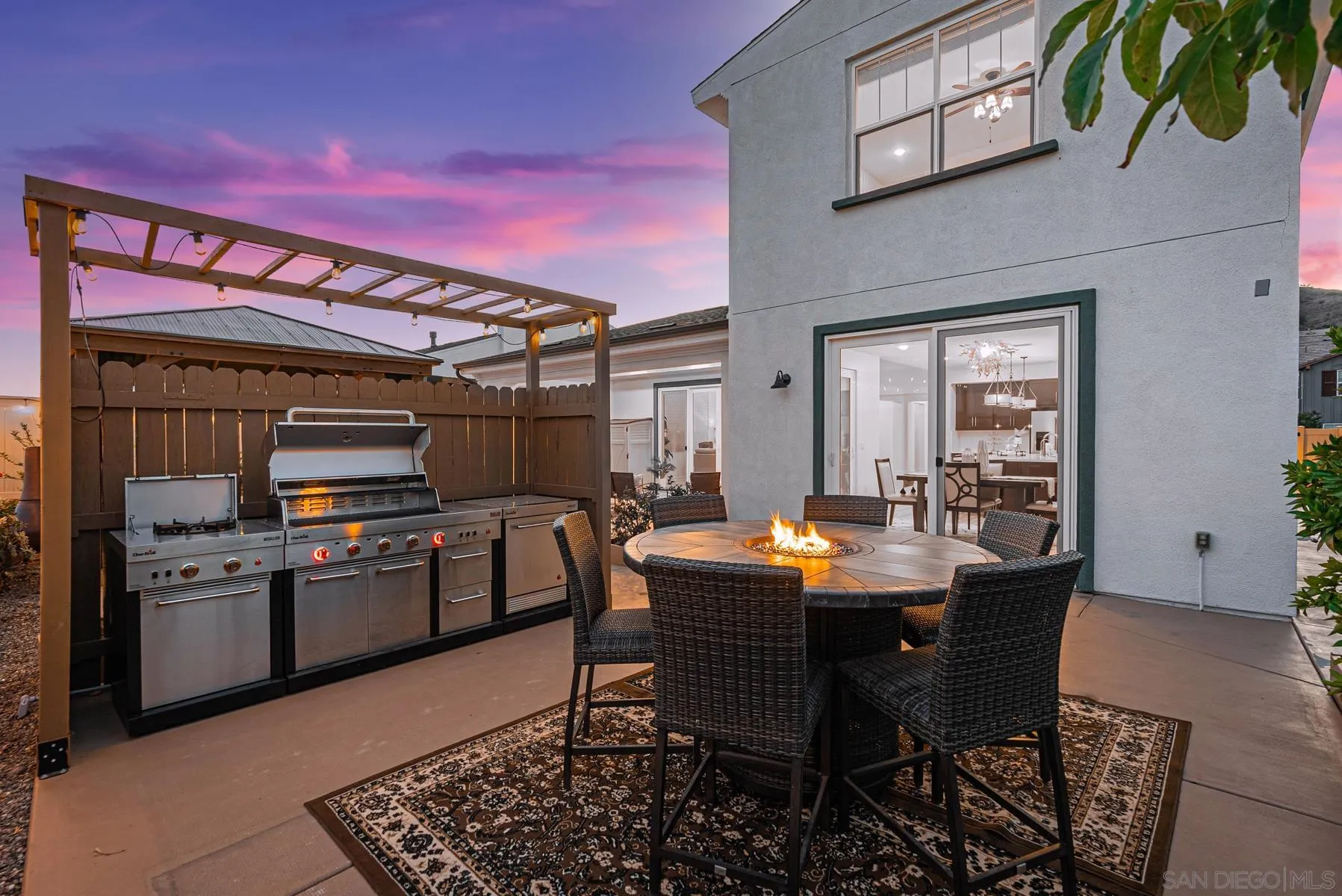 8855 Weston Road Santee, CA 92071 - Photo 33 of 36 a dining room with a wooden table and chairs