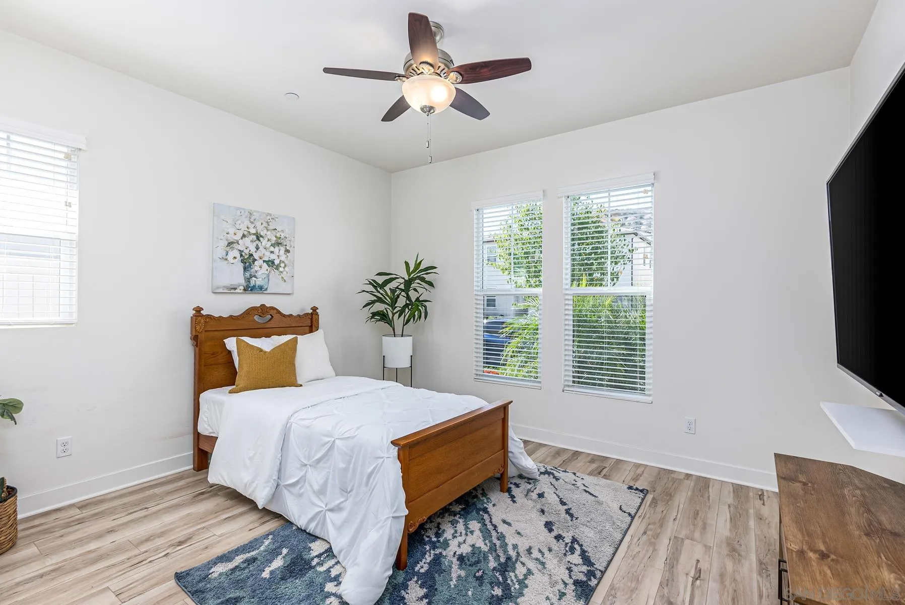 8855 Weston Road Santee, CA 92071 - Photo 5 of 36 a bedroom with a bed and a flat screen tv