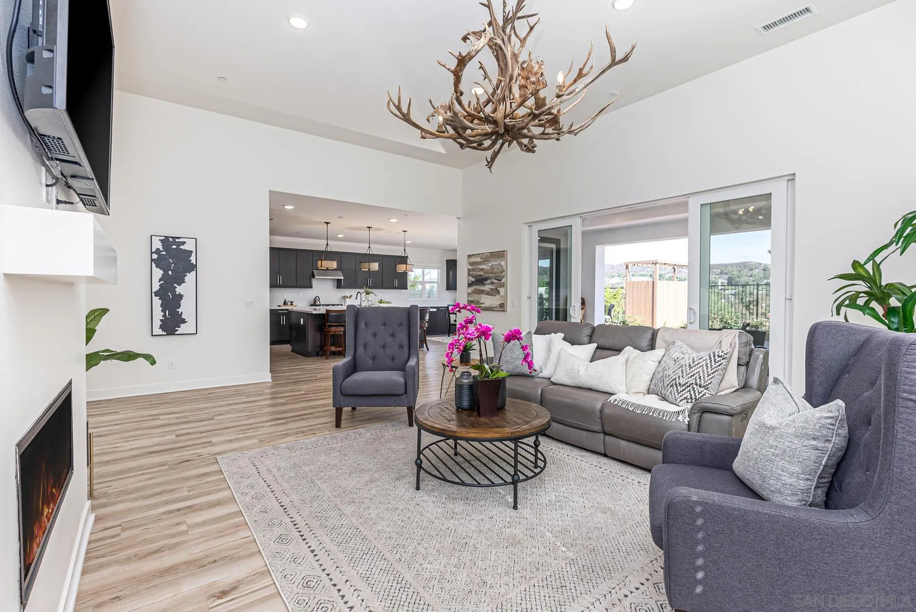 8855 Weston Road Santee, CA 92071 - Photo 10 of 36 a living room with furniture and a flat screen tv