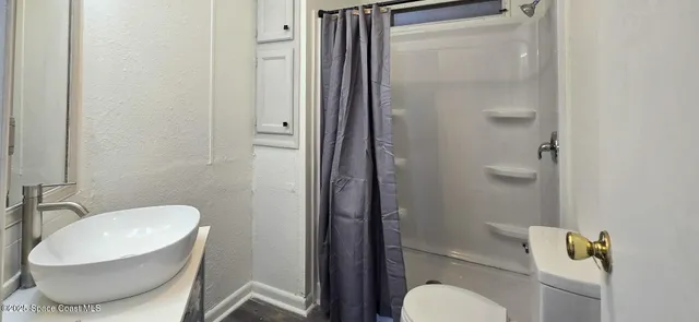 a bathroom with a toilet and a sink