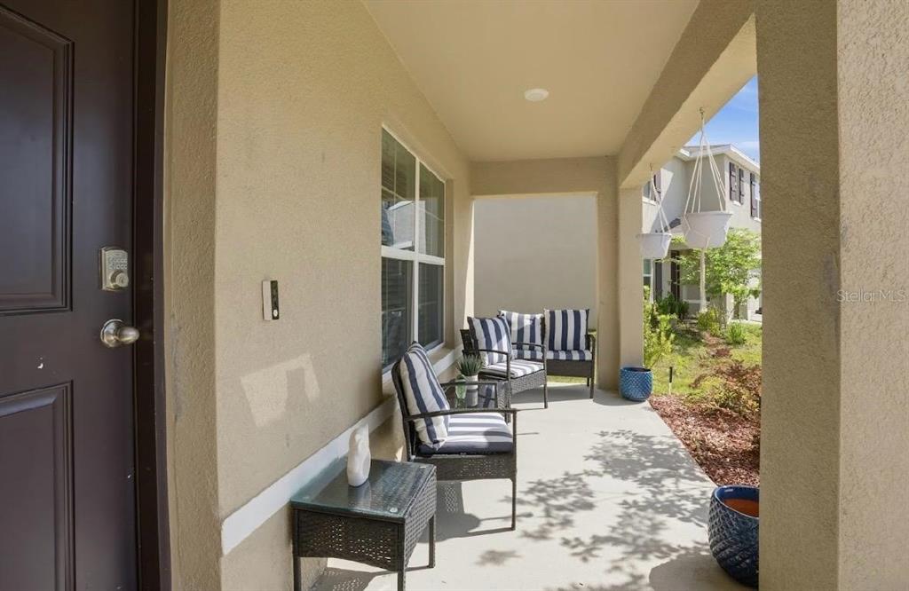 6761 Southeast 3rd Loop Ocala, FL 34472 - Photo 2 of 32 a balcony with furniture and rug