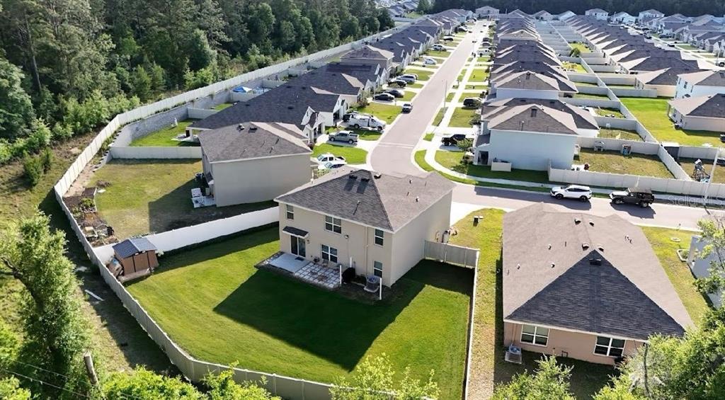 6761 Southeast 3rd Loop Ocala, FL 34472 - Photo 27 of 32 an aerial view of a house with a garden and swimming pool