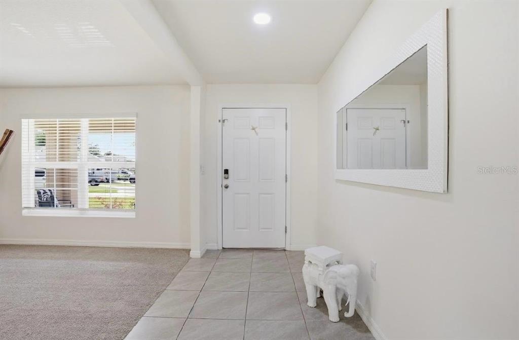 6761 Southeast 3rd Loop Ocala, FL 34472 - Photo 4 of 32 a view of an empty room with a window
