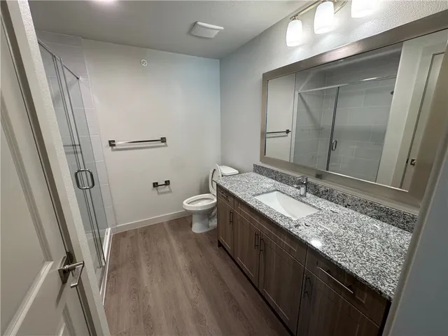 a view of a chairs and table in the balcony