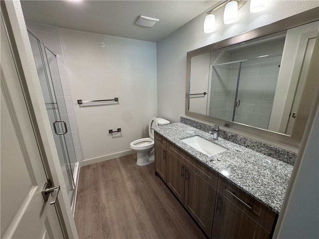 6000 Jones Road, Unit 4207 Bryan, TX 77807 - Photo 14 of 20 a bathroom with a granite countertop sink toilet and shower