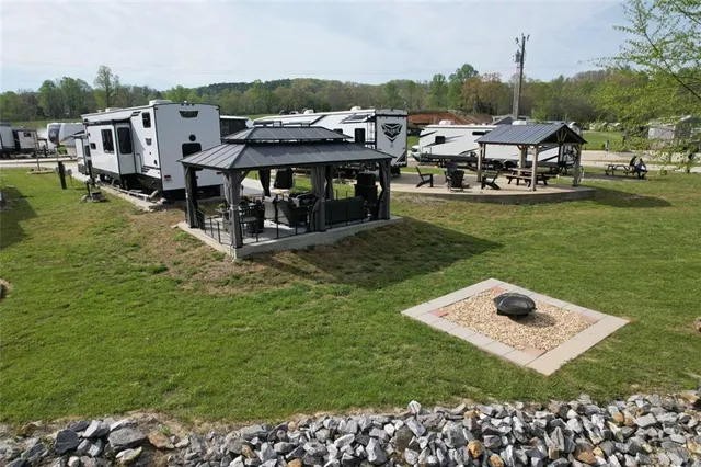 a view of a house with a yard and sitting area