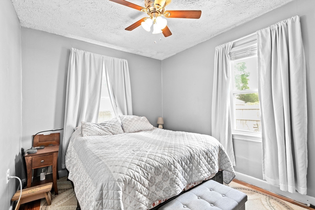 93 Warren Street Fall River, MA 02721 - Photo 11 of 42 a bedroom with a bed and a window