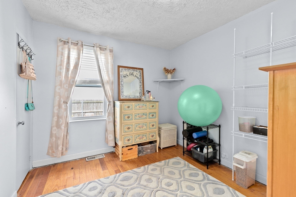 93 Warren Street Fall River, MA 02721 - Photo 13 of 42 a bedroom with a bed and a window