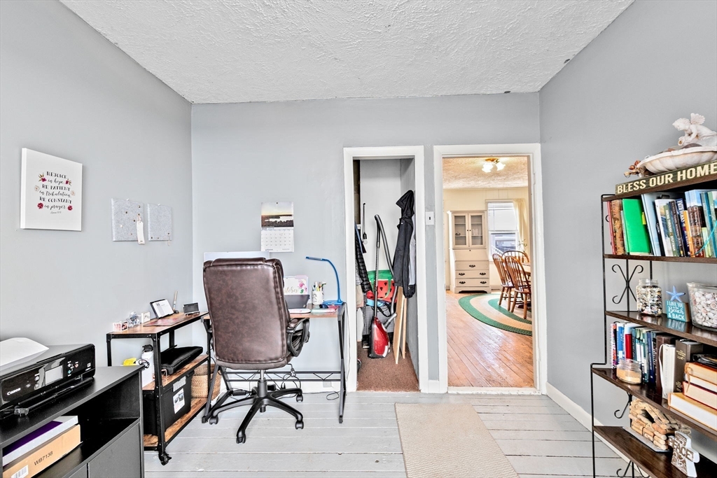 93 Warren Street Fall River, MA 02721 - Photo 15 of 42 a view of a workspace with furniture and bedroom