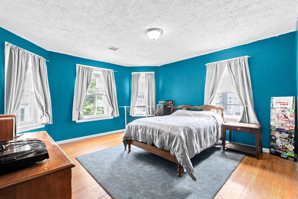 93 Warren Street Fall River, MA 02721 - Photo 24 of 42 a bedroom with a bed and a window