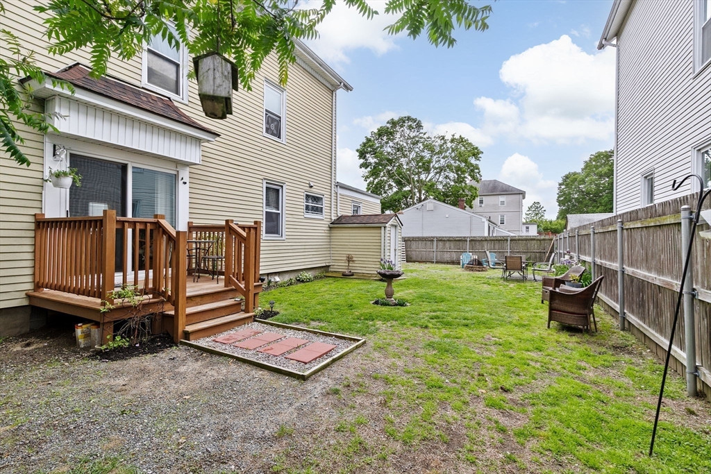 93 Warren Street Fall River, MA 02721 - Photo 30 of 42 a view of backyard with outdoor seating and a garden