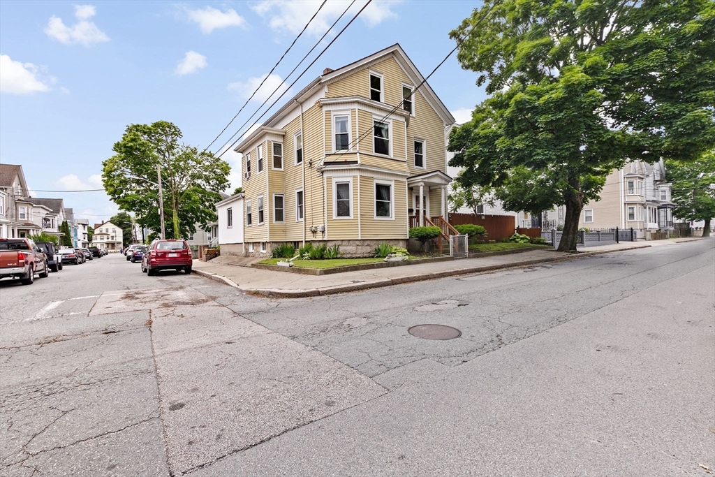 93 Warren Street Fall River, MA 02721 - Photo 34 of 42 a view of a white house with a large trees