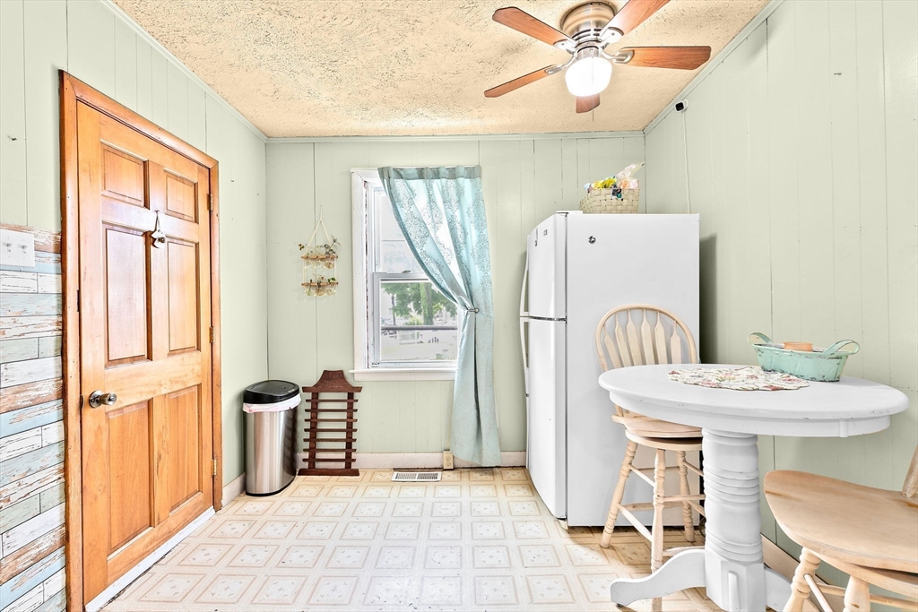 93 Warren Street Fall River, MA 02721 - Photo 6 of 42 a dining room with furniture and a window
