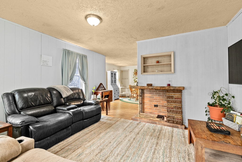 93 Warren Street Fall River, MA 02721 - Photo 9 of 42 a living room with furniture and wooden floor
