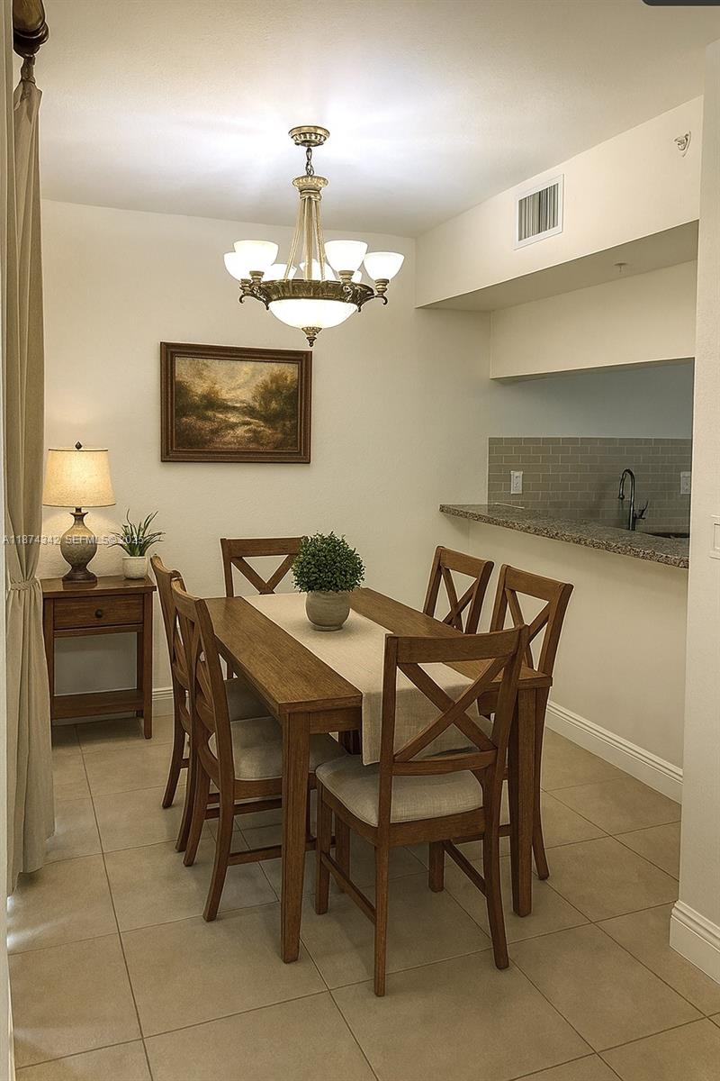 6312 West Sample Road, Unit 6312 Coral Springs, FL 33067 - Photo 7 of 21 a view of a dining room with furniture