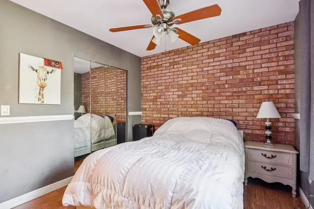 a bedroom with double bed and a window