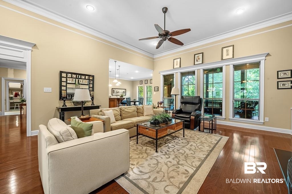 29976 Dolive Ridge Daphne, AL 36527 - Photo 15 of 58 Living room with crown molding, hardwood / wood-style floors, and ceiling fan