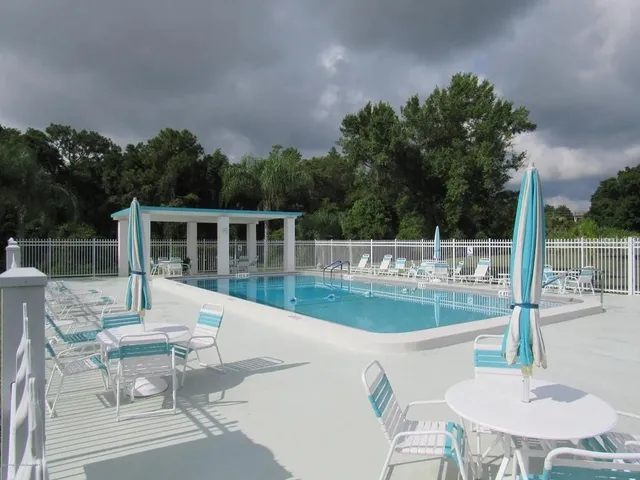 a view of a patio with swimming pool
