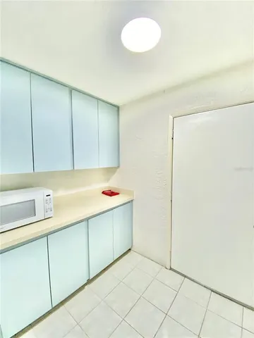 a room with a sink and cabinets