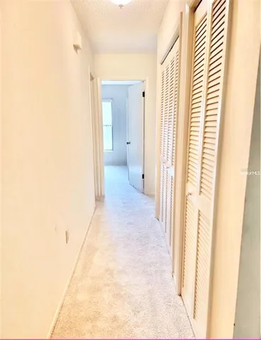 a view of a bathroom from a hallway