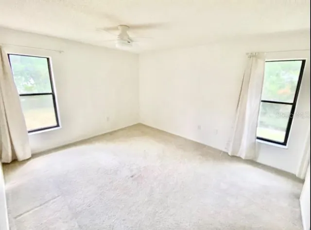 an empty room with windows