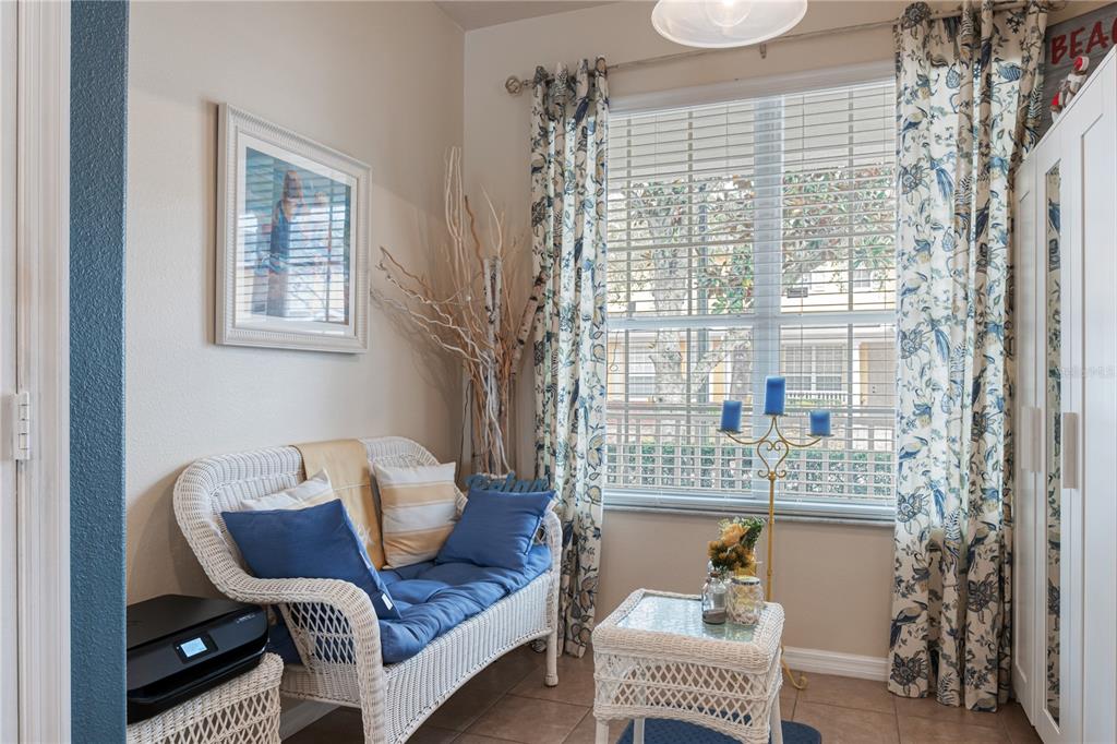 4925 Poolside Drive St. Cloud, FL 34769 - Photo 8 of 36 a living room with furniture and a floor to ceiling window