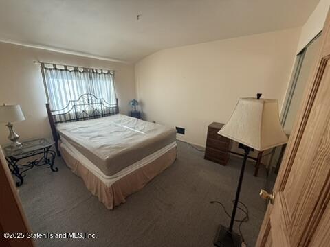 89 Kenmore Street Staten Island, NY 10312 - Photo 11 of 18 a bedroom with a bed and window