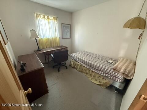 89 Kenmore Street Staten Island, NY 10312 - Photo 12 of 18 a bedroom with a bed and a window