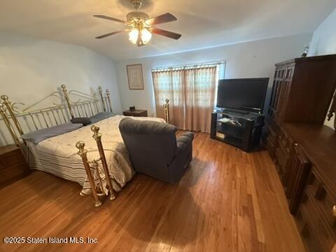 89 Kenmore Street Staten Island, NY 10312 - Photo 13 of 18 a bedroom with furniture and wooden floor