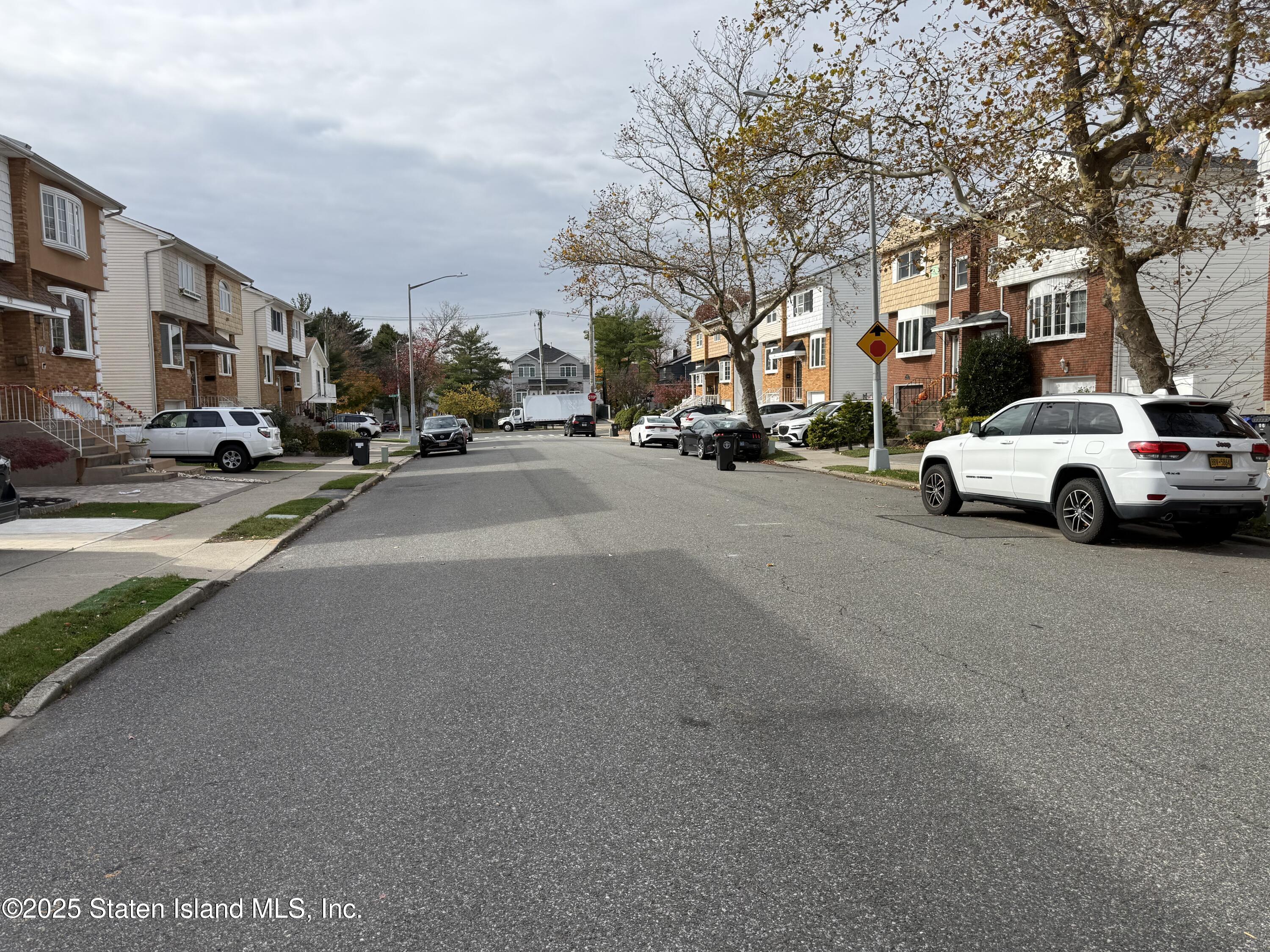 89 Kenmore Street Staten Island, NY 10312 - Photo 3 of 18 a view of city street with parked cars