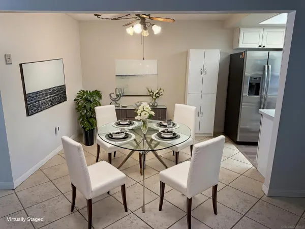 a dining room with furniture and window