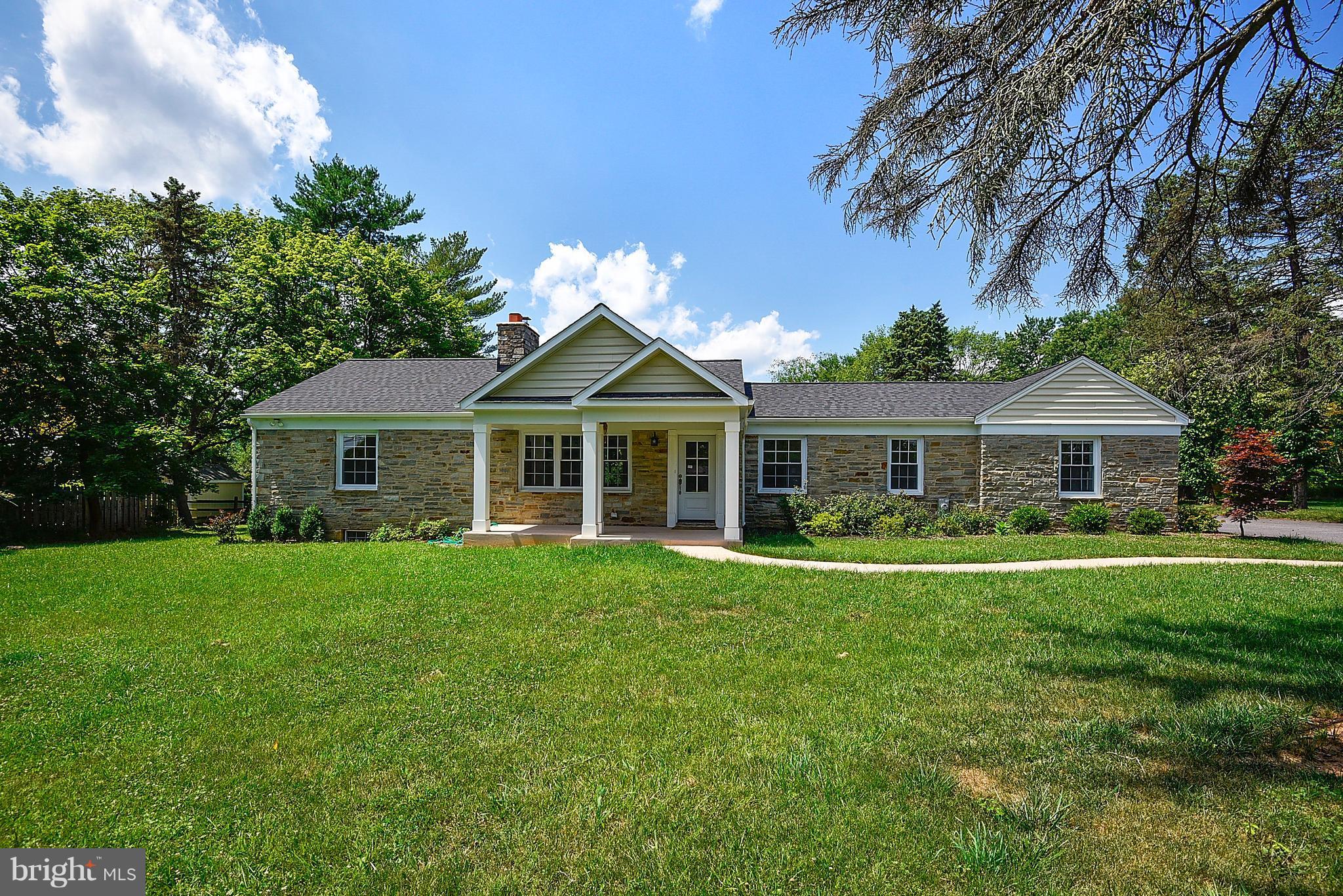 13039 Beaver Dam Road Cockeysville, MD 21030 - Photo 1 of 20 a front view of a house with a garden