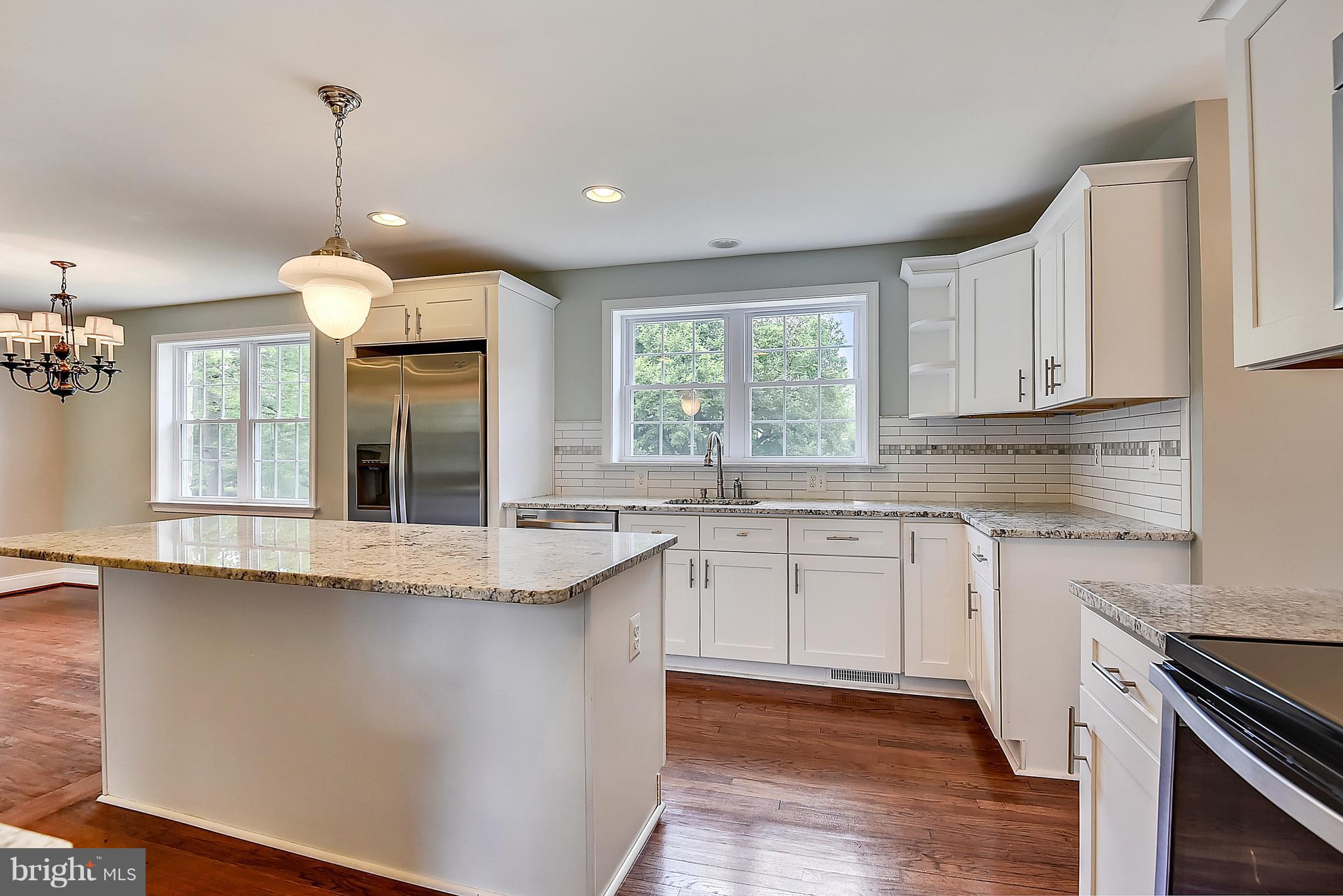 13039 Beaver Dam Road Cockeysville, MD 21030 - Photo 2 of 20 a kitchen with granite countertop a sink cabinets and window